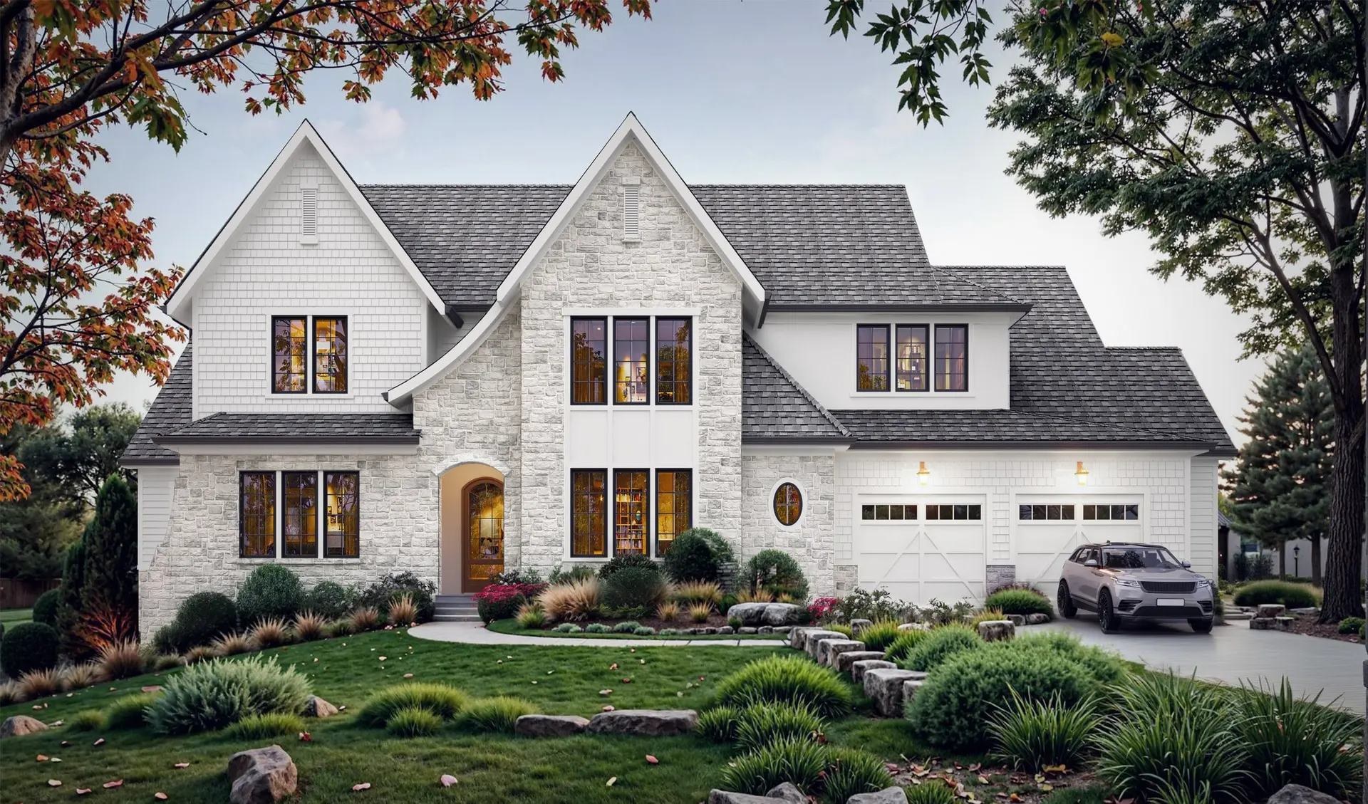 Rendering of 1130 Rookwood Dr.: a modern Tudor of white brick and stone with steep gables, black-framed windows, an arched wood front door and a side garage behind autumn landscaping